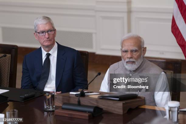 Tim Cook, chief executive officer of Apple Inc., left, and Narendra Modi, India's prime minister, during an event with US President Joe Biden, not...