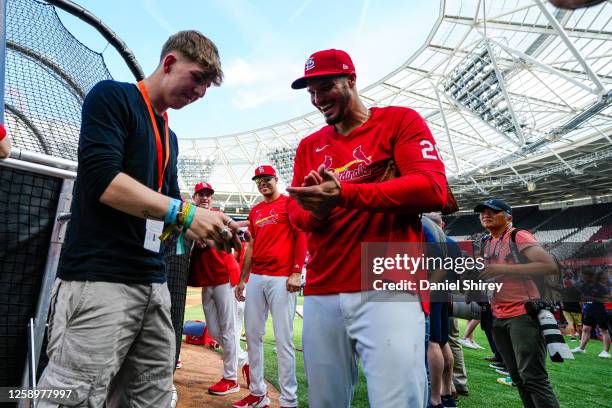 Nolan Arenado of the St. Louis Cardinals with the pitchside magician during the 2023 London Series Workout Day at London Stadium on Friday, June 23,...