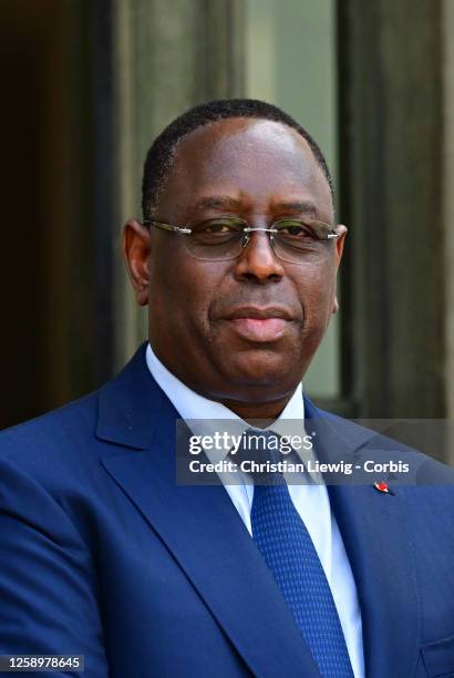 French President Emmanuel Macron greets Senegal's President Macky Sall for their meeting at the Elysee Palace, amid the New Global Financial Pact...