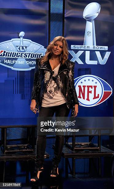 Fergie of the Black Eyed Peas speaks at the Bridgestone Super Bowl XLV Halftime Show press conference on February 3, 2011 in Dallas, Texas.