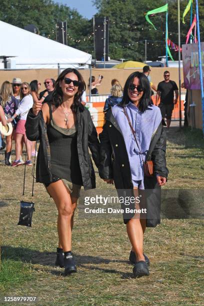 Lily James and Billie Piper are seen on day one of the Glastonbury Festival wearing their Barbour wax jackets on June 23, 2023 in Glastonbury,...