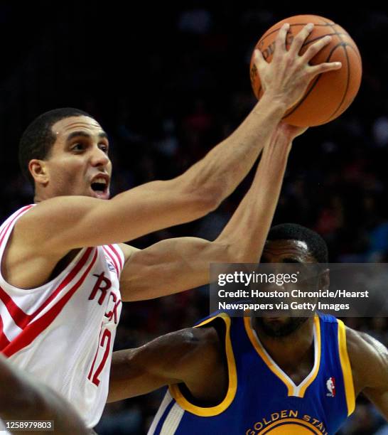 Houston Rockets shooting guard Kevin Martin goes to the basket past Golden State Warriors small forward Reggie Williams during the second half of an...