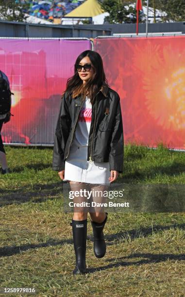 Gemma Chan is seen on day one of the Glastonbury Festival wearing her Barbour wax jacket on June 23, 2023 in Glastonbury, England.