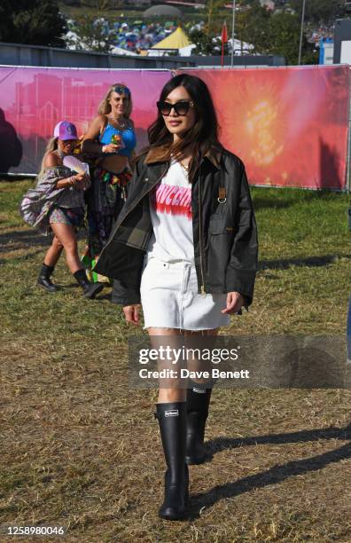 Gemma Chan is seen on day one of the Glastonbury Festival wearing her Barbour wax jacket on June 23, 2023 in Glastonbury, England.