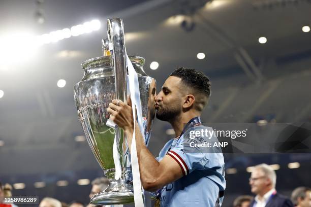 Riyad Mahrez of Manchester City FC kisses the UEFA Champions League trophy, Coupe des clubs Champions Europeen during the UEFA Champions League Final...
