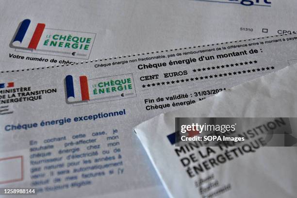 In this photo illustration, the documents concerning the energy check seen on display. To cope with soaring energy prices in French households, the...