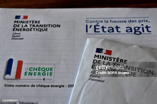 In this photo illustration, the documents concerning the energy check seen on display. To cope with soaring energy prices in French households, the...