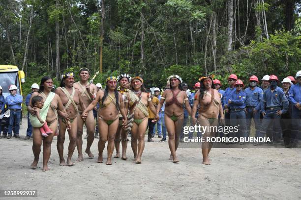 Indigenous Waorani people from the Kawymeno community are pictured in the Yasuni National Park during a demonstration in favor of oil exploitation by...