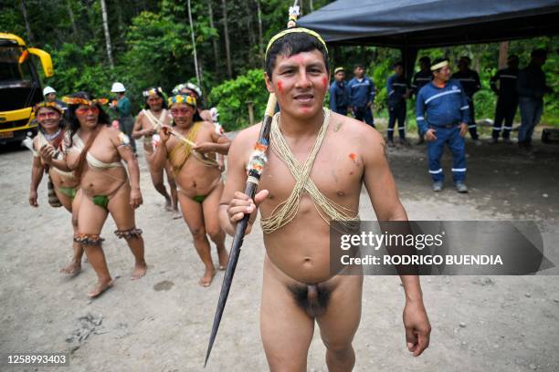 Indigenous Waorani people from the Kawymeno community are pictured in the Yasuni National Park during a demonstration in favor of oil exploitation by...