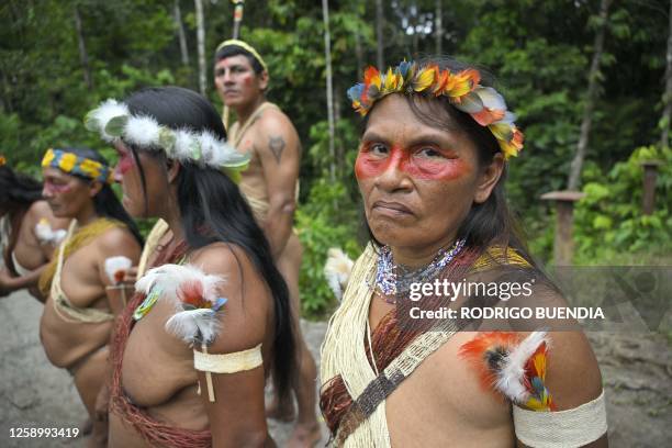 Indigenous Waorani people from the Kawymeno community are pictured in the Yasuni National Park during a demonstration in favor of oil exploitation by...