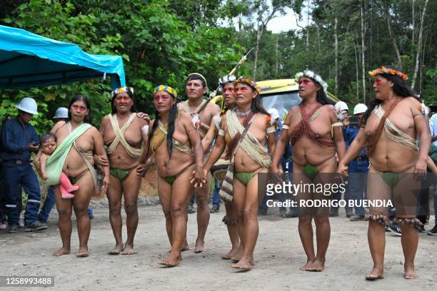 Indigenous Waorani people from the Kawymeno community are pictured in the Yasuni National Park during a demonstration in favor of oil exploitation by...