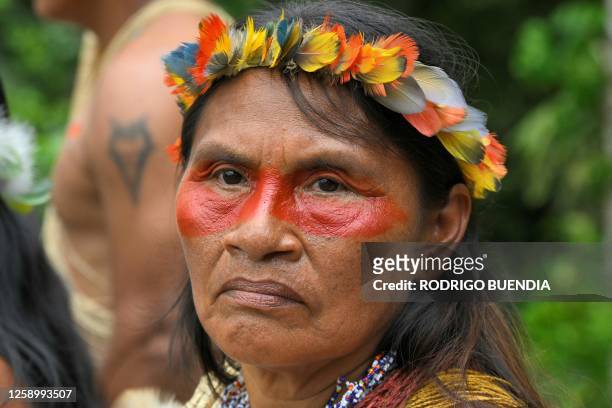An Indigenous Waorani from the Kawymeno community is pictured in the Yasuni National Park during a demonstration in favor of oil exploitation by...