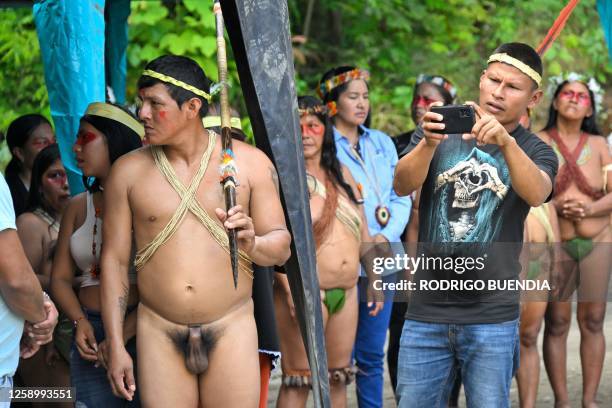 Indigenous Waorani people from the Kawymeno community are pictured in the Yasuni National Park during a demonstration in favor of oil exploitation by...