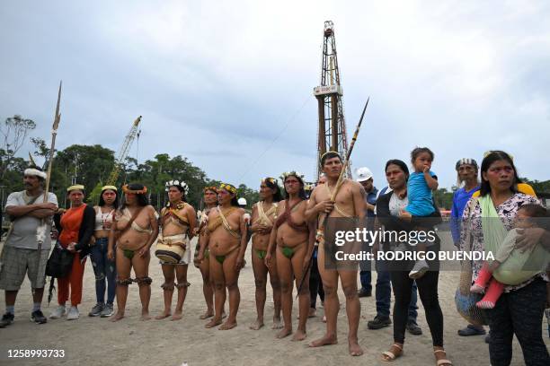 Indigenous Waorani people from the Kawymeno community are pictured in the Yasuni National Park during a demonstration in favor of oil exploitation by...