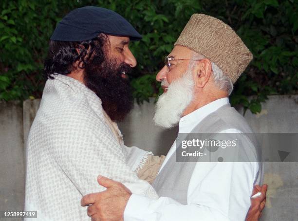 Qazi Hussain Ahmed , chief of Pakistan's main religio-political party Jamaat-i-Islami meets with Syed Salahuddin, supreme commander of Hizbul...