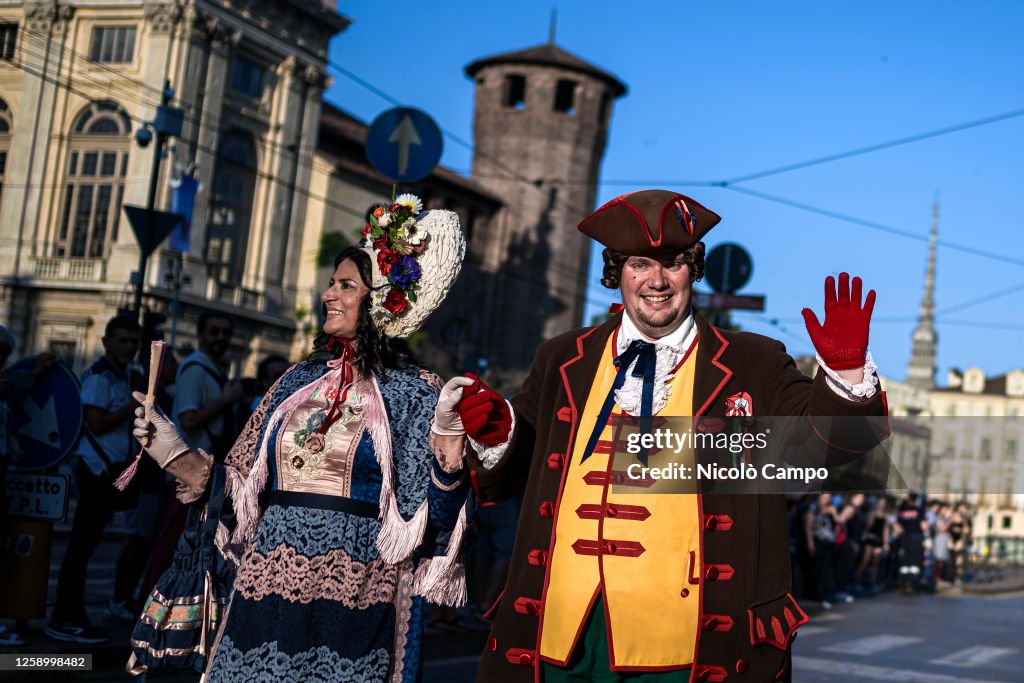 Two people wearing traditional costumes of Gianduja (R) and...