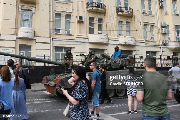 Members of Wagner group sit atop of a tank in a street in the city of Rostov-on-Don, on June 24, 2023. President Vladimir Putin on June 24, 2023 said...