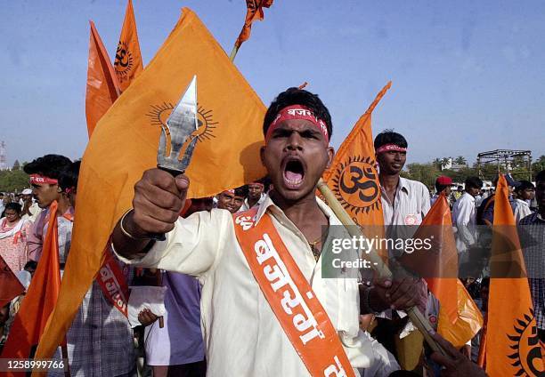 Supporter of India's Right-wing militant Hindu organisation 'Vishwa Hindu Parishad' shouts slogans in a rally organised to celebrate the 75th...