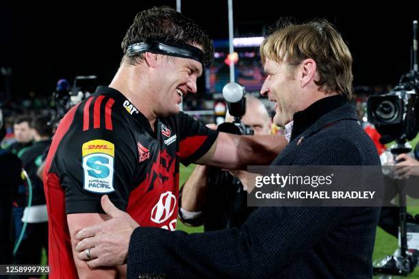 Crusaders head coach Scott Robertson gives a hug to Scott Barrett after winning the Super Rugby Pacific final match between the Chiefs and Crusaders...