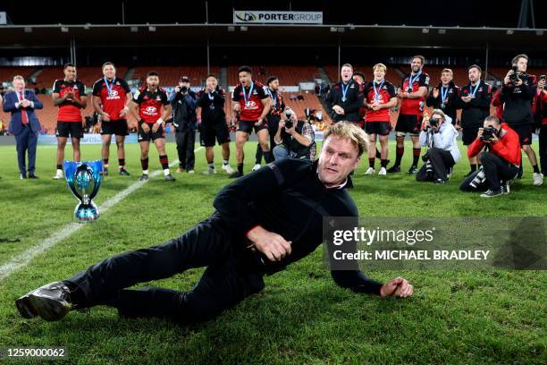 Crusaders head coach Scott Robertson celebrates with some break dance moves after winning the Super Rugby Pacific final match between the Chiefs and...