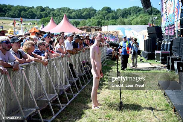 Naked man tries to interrupt the show with a speech down the audience microphone before being escorted away as Tilda Swinton performs with Max...