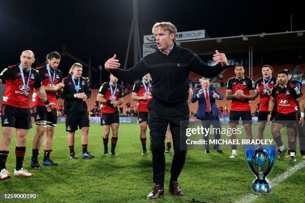 Crusaders head coach Scott Robertson celebrates with some break dance moves after winning the Super Rugby Pacific final match between the Chiefs and...