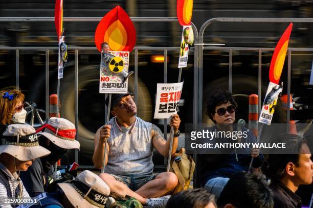 Activists gather to protest against a planned release of water from the Fukushima Dai-Ichi nuclear plant in Japan, in Seoul on June 24, 2023.