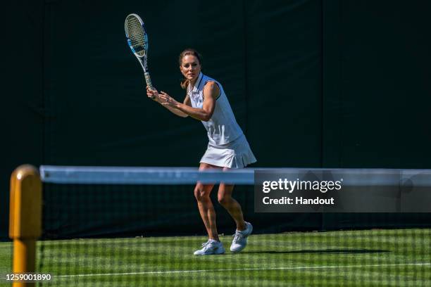 In this handout images released by Kensington Palace on June 24 Catherine, Princess of Wales playing tennis on No.3 Court at The All England Lawn...