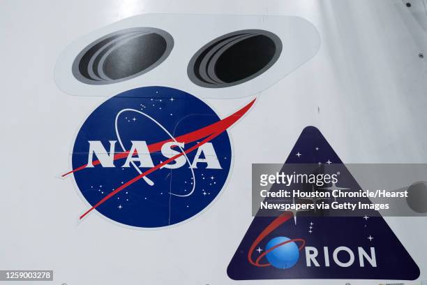 Exterior logos are shown on the outside an Orion spacecraft mockup at NASA's Johnson Space Center Tuesday, May 17, 2022 in Houston. This spacecraft...