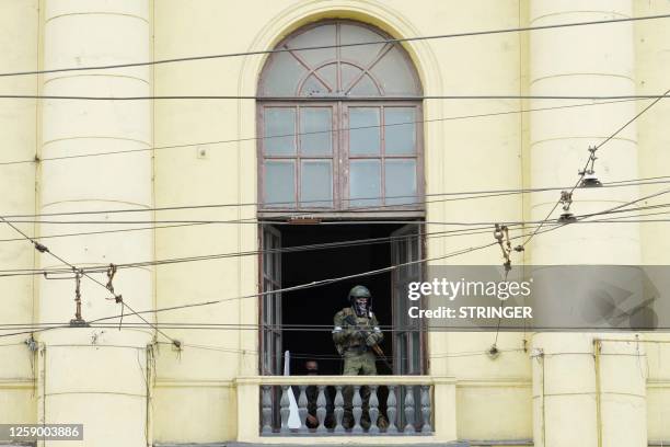 Member of Wagner group stands on the balcony of the circus building in the city of Rostov-on-Don, on June 24, 2023. President Vladimir Putin on June...