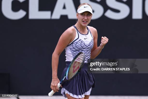 Russia's Anastasia Potapova reacts to winning the first set while playing Latvia's Jelena Ostapenko during their women's singles semi-final tennis...