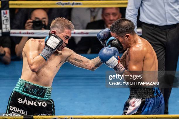 Kazuto Ioka of Japan fights against Joshua Franco of the US during their WBA world super flyweight title boxing match in Tokyo on June 24, 2023.