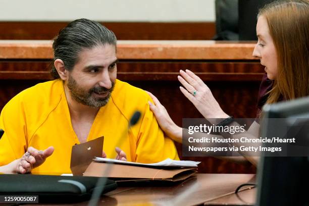 Robert Solis speaks to Mandy Miller, one of his lawyers, as he appears in court to consider representing himself or get new counsel in the capital...