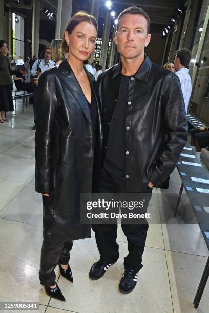 Lara Worthington and Sam Worthington attend the Hermès SS24 Men's Show at Palais D'iena on June 24, 2023 in Paris, France.