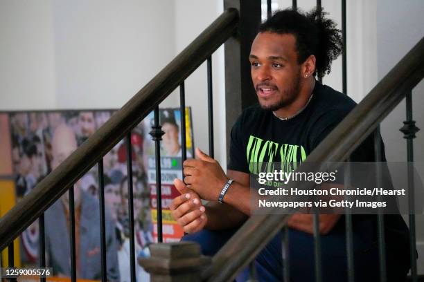 Houston Texan fullback Troy Hairston sits on the stairs in his new townhouse Monday, Oct. 3, 2022 in Houston.