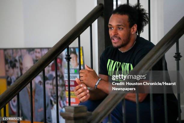 Houston Texan fullback Troy Hairston sits on the stairs in his new townhouse Monday, Oct. 3, 2022 in Houston.