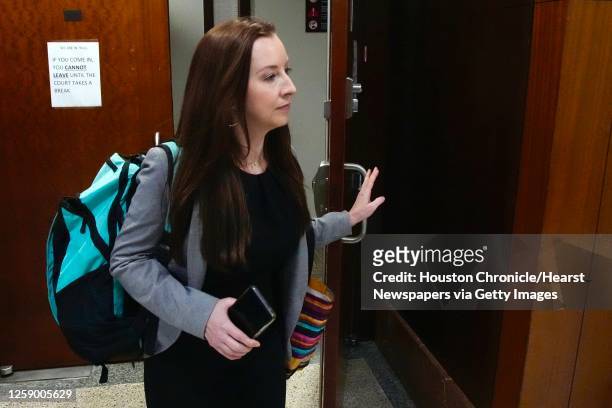 Mandy Miller, one of Robert Solis' former defense attorneys, leaves the courtroom after being dismissed as his lawyer Monday, Oct. 10 in Houston....