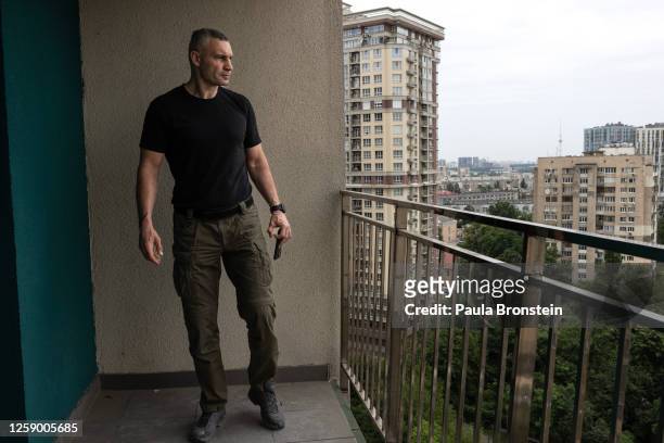 Kyiv Mayor Vitali Klitschko surveys scene of the early morning attack that destroyed the 18th floor apartment killing 3 and injuring 11 people on...