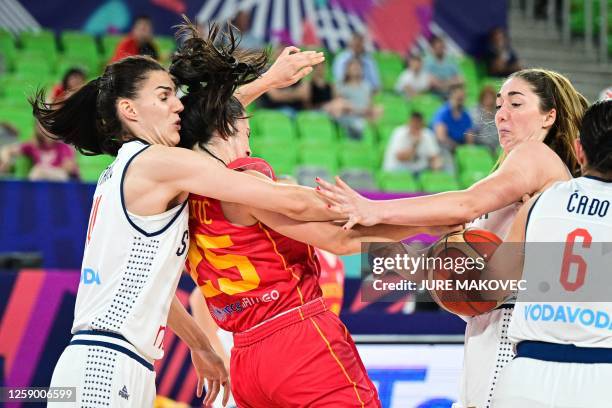 Montenegro's Marija Lekovic fights for the ball with Serbia's Dragana Stankovic and Masa Jankovic during the FIBA Women's Eurobasket 2023...