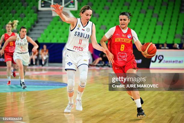 Montenegro's Dragana Zivkovic fights for the ball with Serbia's Aleksandra Crvendakic during the FIBA Women's Eurobasket 2023 classification match...