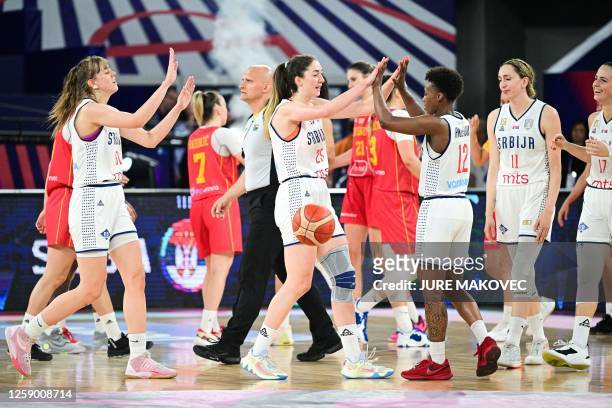 Serbia's players celebrate after winning the FIBA Women's Eurobasket 2023 classification match for the 2024 Olympic qualifiers between Serbia and...