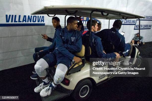 Villanova guard Josh Hart , Villanova forward Kris Jenkins , Villanova guard Ryan Arcidiacono ride in a cart to interviews before the NCAA basketball...