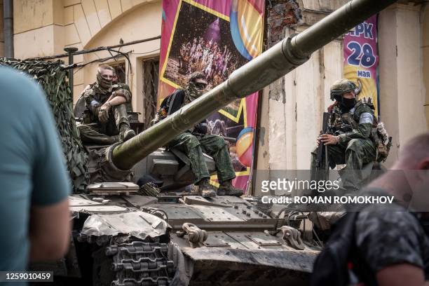 Members of Wagner group sit atop of a tank in a street in the city of Rostov-on-Don, on June 24, 2023. President Vladimir Putin on June 24, 2023 said...
