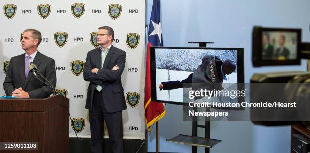 Sgt. Tommy Rulan, left, and Lt. John McGalin, of the Houston Police Department release surveillance video, showing a person of interest in the death...