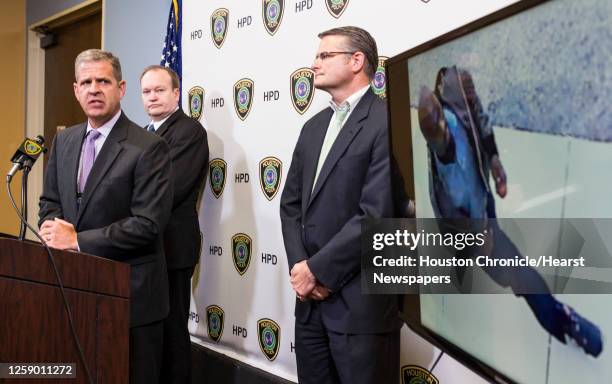 Sgt. Tommy Rulan, left, and Lt. John McGalin, of the Houston Police Department release surveillance video, showing a person of interest in the death...