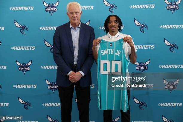 General Manager Mitch Kupchak and Nick Smith Jr. Of the Charlotte Hornets pose for a portrait on June 23, 2023 at Spectrum Center in Charlotte, North...