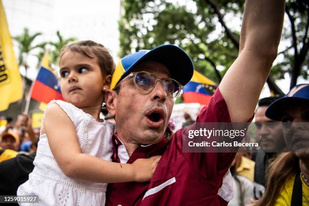 Opposition leader Henrique Capriles arrives to a rally with his daughter and family at La Castellana on June 24, 2023 in Caracas, Venezuela. Henrique...