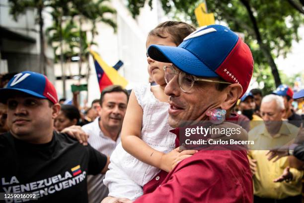 Opposition leader Henrique Capriles arrives to a rally with his daughter at La Castellana on June 24, 2023 in Caracas, Venezuela. Henrique Capriles...