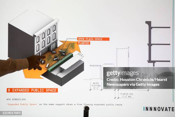 Kinder Baumgardner, managing principal SWA, shows a rendering as he talks about a proposal, Monday, July 27 to close Main Street to vehicular traffic...