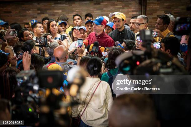 Opposition leader Henrique Capriles addresses the media after signing his presidential candidacy application at the national primary commission on...